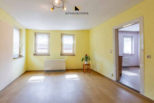 1.OG Wohnzimmer- Wärme und Gemütlichkeit: Das Herzstück des Hauses - 