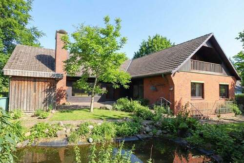 Rückansicht (saisonale Anpassung durch KI) - Einfamilienhaus mit 150,70 m&sup2; in Kaltenkirchen zum Kaufen