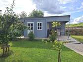 Gartenhaus mit überdachtem Grillplatz. - 