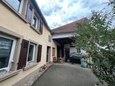 Ansicht Haus mit Nebengebäude - 5 Zimmer Einfamilienhaus zum Kaufen in Breitenheim