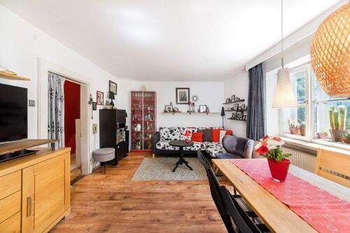 Wohnzimmer im EG - 6 Zimmer Einfamilienhaus zum Kaufen in München