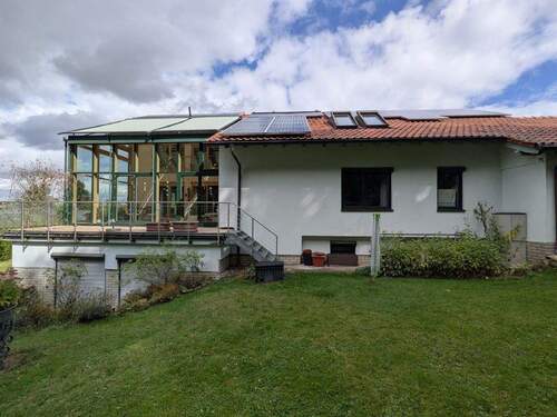 Rückansicht mit Terasse Wintergarten - Einfamilienhaus mit 252,40 m² in Korbach zum Kaufen