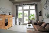 zweiter Wohnbereich mit Zugang zur Terrasse - 
