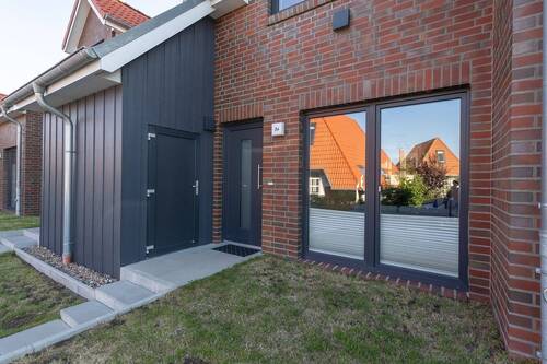 Außenansicht Eingangsbereich mit Abstellraum - Ferienreihenhaus mit Stil-Hier beginnt Erholung