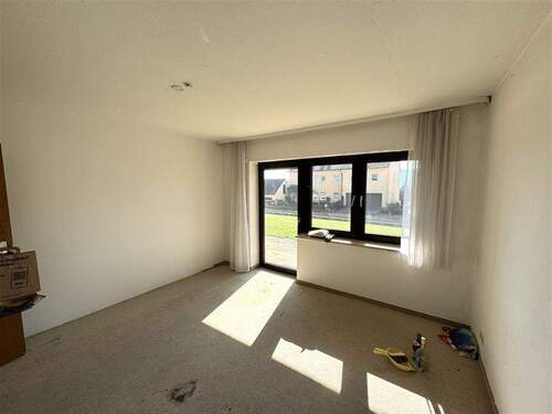 Schlafzimmer im Erdgeschoss mit Zugang zum Garten - 