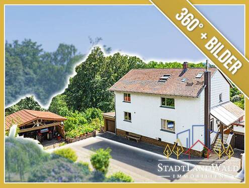 Titelbild - Exposé - Gepflegtes Zweifamilienhaus mit großem Garten, Carport und Garagen in Clausen