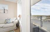 Teilansicht Wohnzimmer - Etagenwohnung mit 47,00 m² in Kellenhusen zum Kaufen