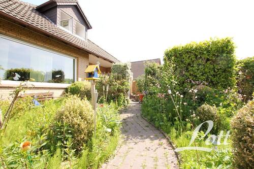 Zuwegung zur Terrasse - Einfamilienhaus mit 222,70 m² in Apen / Augustfehn zum Kaufen