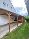 Carport mit Ladestation neben Garage.jpg - 