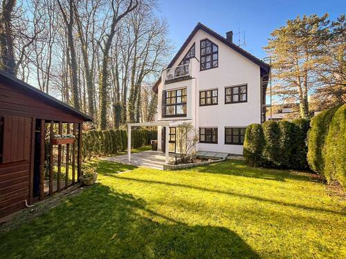 Haus- und Gartenansicht - Exklusive Gartenwohnung. In ruhiger Lage von Solln.