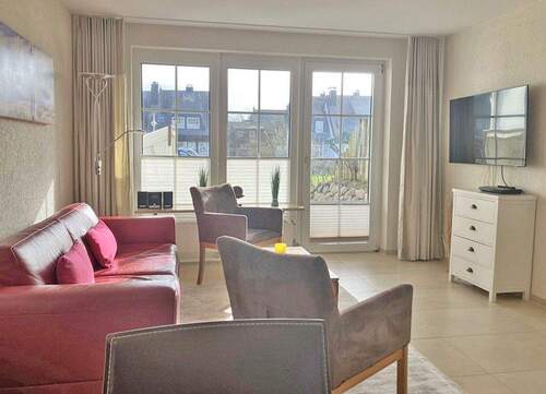 Wohnraum mit Blick zur Südterrasse - 3 Zimmer Etagenwohnung in Wenningstedt-Braderup