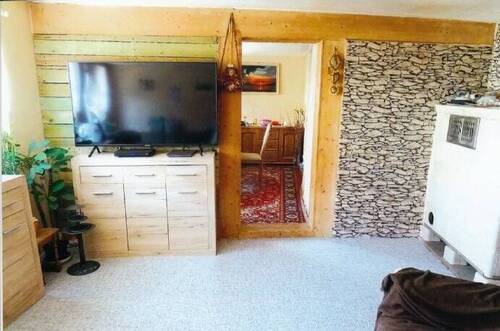 Bild 8EG - Wohnzimmer mit Kachelofen - 