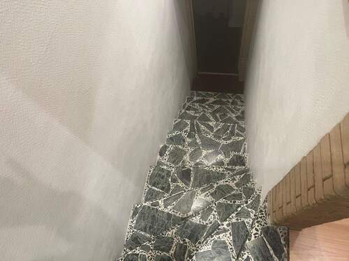 Treppe zum wohnlich ausgebauten Hobbykeller - 