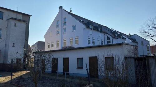 Rückseitige Giebelansicht - Etagenwohnung mit 83,40 m² in Niesky zum Kaufen