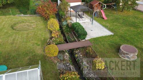 Gartenbereich mit Bachlauf - Mehrfamilienhaus, Wohnhaus mit 151,60 m² in Weismain zum Kaufen
