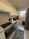 Küche mit Einbauküche - Etagenwohnung mit 55,80 m² in Kiel zum Kaufen