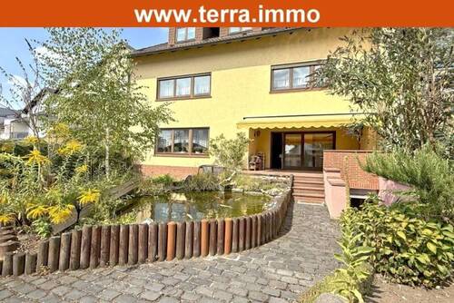 Gartenansicht - großzügiges Familienhaus mit Büro, Doppelgarage und schönem Grundstück!