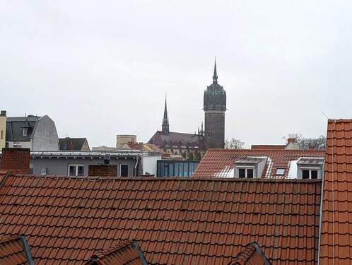 Blick aus dem Fenster auf die Schloßkirche - 9 Zimmer Mehrfamilienhaus, Wohnhaus in Lutherstadt Wittenberg