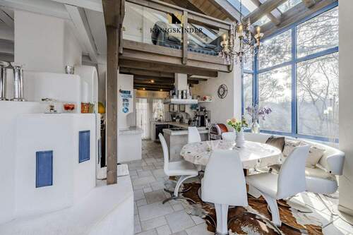 Große Glasfläche am Essbereich mit Kamin - 