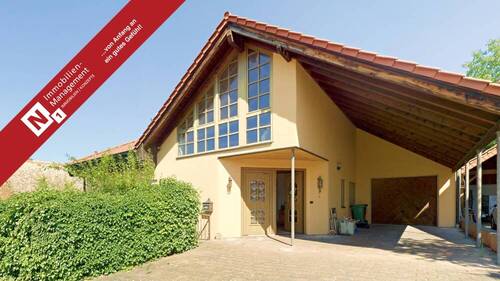 Außenansicht - Architektonisch ansprechender Bungalow mit Wintergarten und Garage auf großzügigem Grundstück