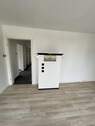 Wohnzimmer mit Kachelofen im DG - 