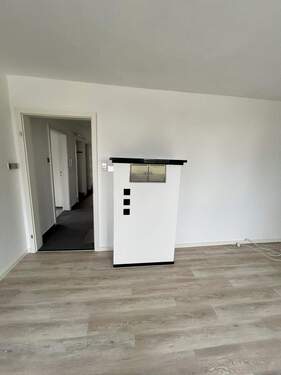 Wohnzimmer mit Kachelofen im DG - 