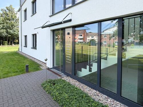 Hauseingang - Etagenwohnung mit 90,20 m&sup2; in Uetersen zum Kaufen