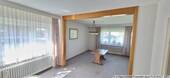 Blick ins Wohnzimmer - 7 Zimmer Mehrfamilienhaus, Wohnhaus zum Kaufen in Rastede