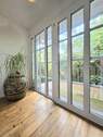 Windfang mit Glas-Eingangstür - 