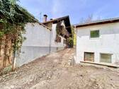 Gartenansicht Garage und Vordergebäude - 