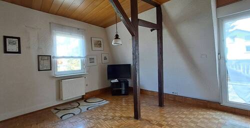Wohnzimmer 1.1 OG mit Zugang zur Terasse - 