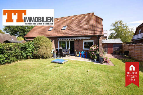 Außenansicht - TT bietet an: Hübsche Doppelhaushälfte mit Gartenidylle - ruhig gelegen in Sande!