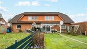 Außenansicht 1 - Attraktives Mehrfamilienhaus mit 4 WEs, Garten und Garagen in Bersenbrück