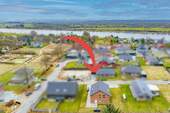 Luftaufnahme - Unten wohnen & oben vermieten: Neugebautes Zweifamilienhaus nahe des Nord-Ostsee-Kanals