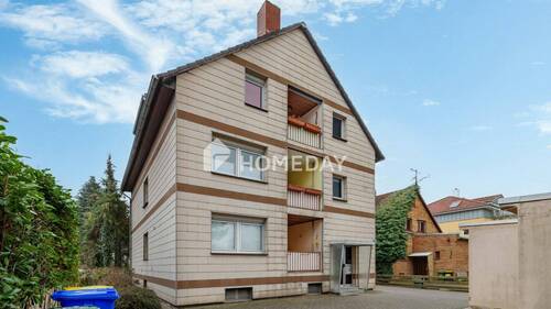 Außenansicht 3 - Attraktive 3-Zimmer-Erdgeschosswohnung - solide vermietet mit Loggia, Garage und Gartennutzung