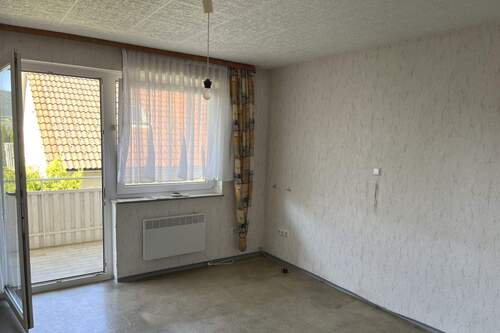 Schlafzimmer im EG mit Zugang zum Balkon - 