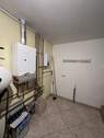 Hauswirtschaftsraum mit separatem Hauseingang - 