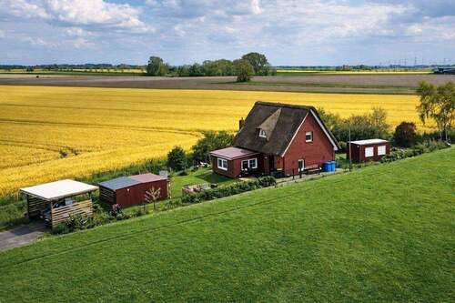 Objektansicht - Ihr perfekter Rückzugsort mit Weitblick! Reetdachhaus vielseitig nutzbar in Groven!