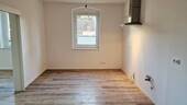 Wohnung EG rechts mit FB-Heizung - 