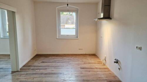 Wohnung EG rechts mit FB-Heizung - 