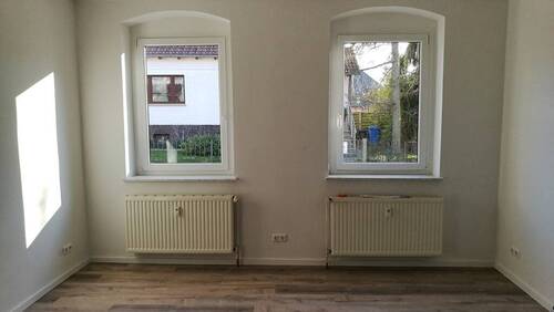 Wohnung Anbau EG Wohnzimmer m. Kamin - 