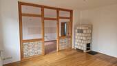Wohnung OG rechts WZ mit Kaminofen - 