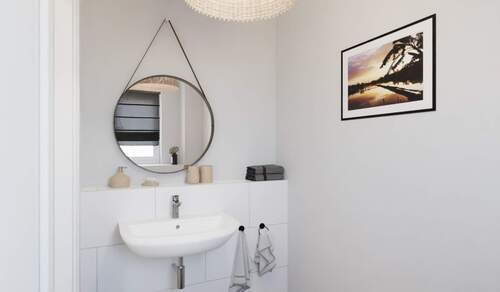 Modern gefliestes Gäste-WC im Erdgeschoss - Doppelhaushälfte mit 113,40 m² in Großpösna zum Kaufen