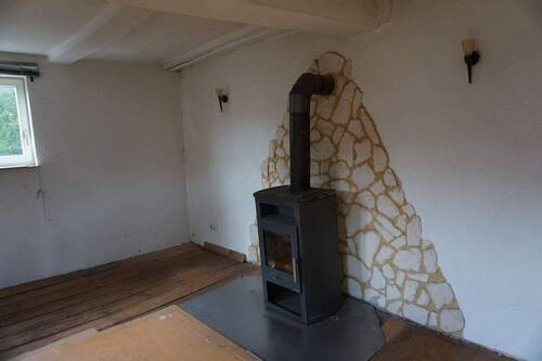Ofen Wohnzimmer EG.JPG - Mehrfamilienhaus, Wohnhaus mit 150,80 m&sup2; in Homberg zum Kaufen