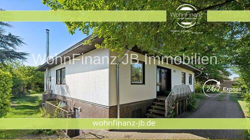 Titelbild Kapitalanleger - Vermietetes Einfamilienhaus auf großem Grundstück nebst großem Baugrundstück in Nähe Moorhüttenteich