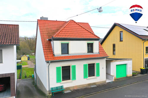 RE/MAX Immobilien DeLux - Charmantes Einfamilienhaus - 159.000,00 EUR Kaufpreis, ca.  120,00 m² Wohnfläche