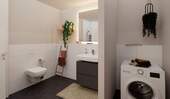 Ein modern gefliestes Badezimmer - Etagenwohnung mit 71,50 m² in Hasloh zum Kaufen