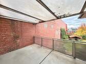 Balkon mit Ziegelfassade - 