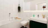 Im Badezimmer erwartet Sie moderner Komfort - Etagenwohnung mit 89,10 m² in Hasloh zum Kaufen
