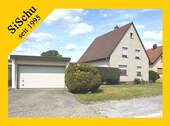 Ansicht mit Garage - Charmantes Wohnhaus in ruhiger Siedlungslage